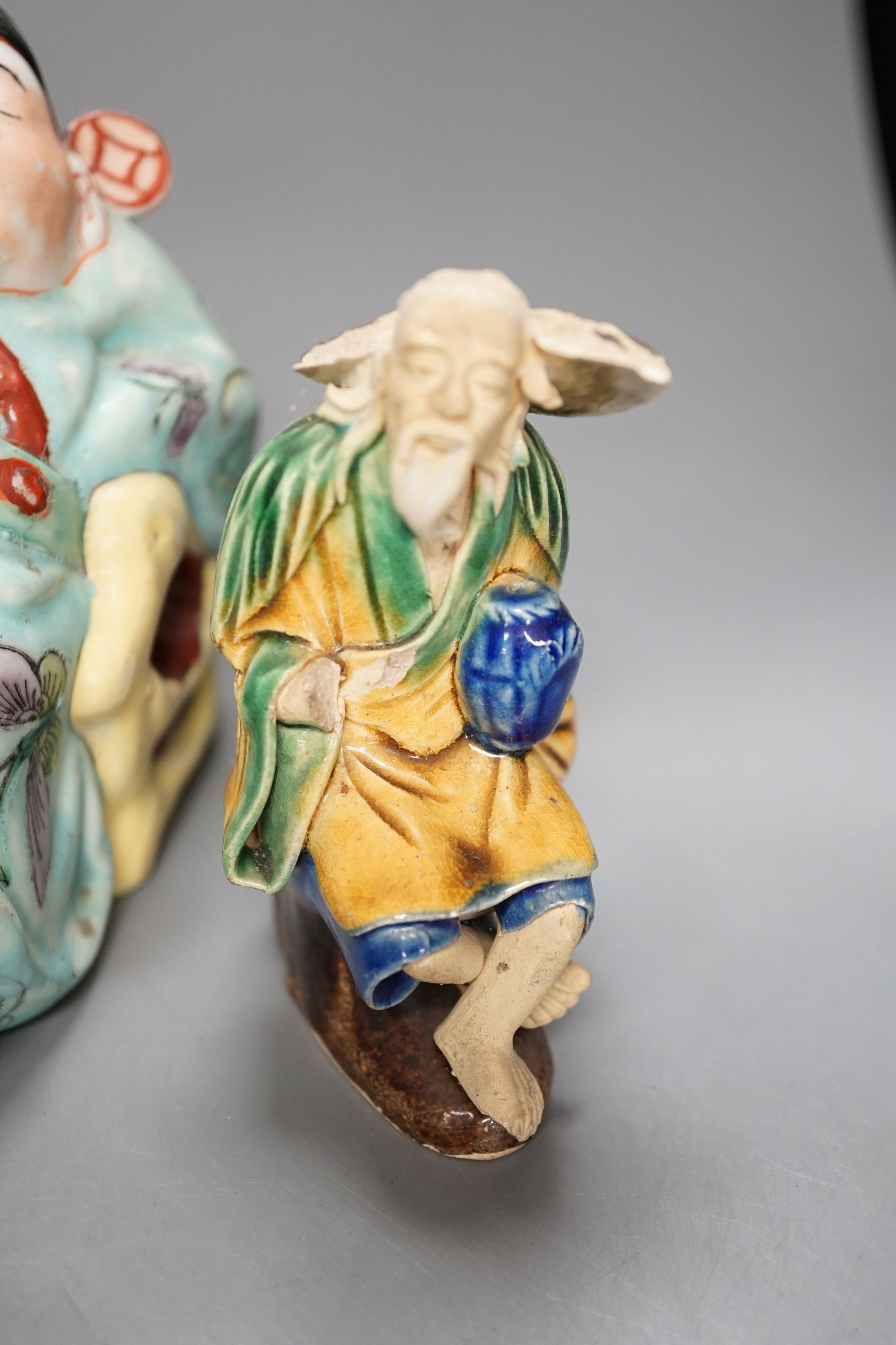 Five Chinese ceramic figures, saucers, etc., tallest 15cm. (18)